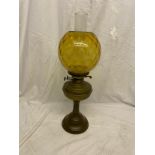 Large brass early oil lamp .