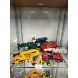 Shelf of play worn vehicles includes corgi Allis chambers fork lift etc .