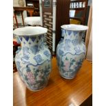 Pair of oriental themed vases .