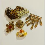 Lot of 5 different design amber vintage brooches.