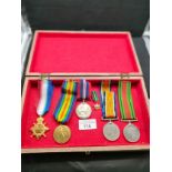Lot of world war one and two medals with ribbons etc .