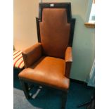 Masonic themed leather throne in brown leather .