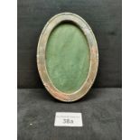 Silver oval photo frame.