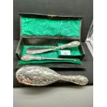 Silver hall marked brush , button hook and shoe horn in fitted Edwardian leather case .