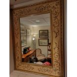 Large beautiful Inlaid design mirror in fitted carved frame.