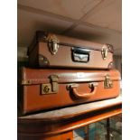2 vintage leather travelling cases .