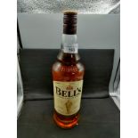 Bottle of bells blended scotch whisky Arthur bell and sons 1 litre full and sealed .