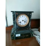 Victorian slate mantle clock with french clock workings .