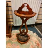 Antique 19th century stick stand with fitted metal plate .
