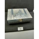 White metal box depicting golden retriever dogs .