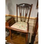Arts and crafts 1900s chair with seating upholstery.