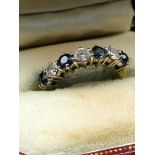 18ct gold sapphire and diamond half eternity ring. 4 brilliant cut sapphires up to 0.90ct .three