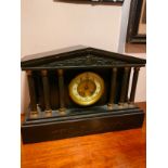 Victorian slate mantle clock with cornithian columns .