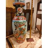 Large oriental vase with bird foliage . 24 inches in height.