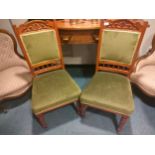 Pair of 20th century chairs with green upholstery.