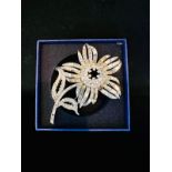 Flower design large statement brooch. Silver tone set with diamante stones. Height 9cm, Width 6.5cm.