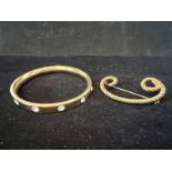 Beautiful gold tone heavy bangle set with crystal stones and vintage rope design gold tone brooch.