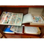 Collection of stamp albums with stamps etc .
