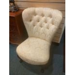 Ornate button back silk spoon back style chair.