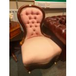 Victorian button back spoon back chair with silk button back design.
