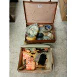 Suit case with paint brushes etc .