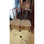 Pair of Victorian Parlour chairs with carved backs and Serpentine legs .