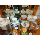 Shelf of various cups and saucers.