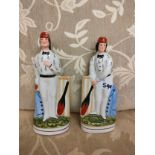 Pair of early Staffordshire flat back cricket figures .