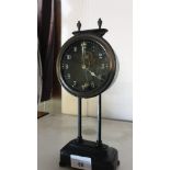 Unusual Mantel clock with pendulum inside face of clock.