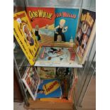 2 shelfs of broons and oor Wullie books .