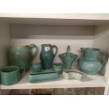 Shelf of Buchan pottery jugs etc .