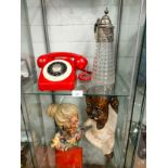 2 large figures , silver plated topped wine pourer together with vintage red phone .