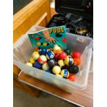 Box of snooker and pool balls .