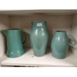 Shelf of early Buchan pottery jugs etc .