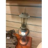 Vintage oil lamp with glass funnel .