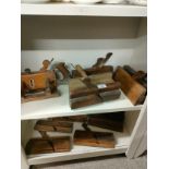2 shelves of antique wood work planes etc.