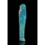 AN EGYPTIAN FAIENCE USHABTI