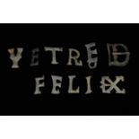 A ROMAN SET OF SILVER MILITARY BELT LETTERS FOR SAYING FELIX VETRE