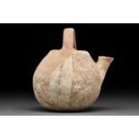 A CANAANITE PAINTED POTTERY SPOUTED JAR