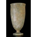 A ROMAN GLASS FOOTED BEAKER