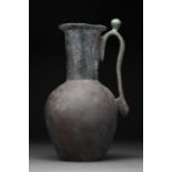 LATE SASSANIAN OR EARLY ISLAMIC BRONZE EWER WITH PROTRUDING LIP