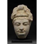 A GANDHARAN SCHIST HEAD OF BODHISATTVA