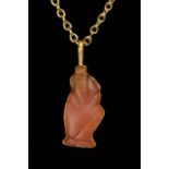 EGYPTIAN CARNELIAN HORUS AS CHILD AMULET IN LATER GOLD PENDANT