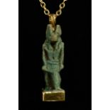 EGYPTIAN FAIENCE AMULET OF ANUBIS IN LATER GOLD PENDANT