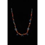 BRONZE AGE GLASS AND BRONZE AMULETIC NECKLACE