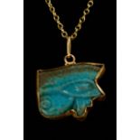 EGYPTIAN FAIENCE WEDJAT-EYE AMULET IN LATER GOLD PENDANT