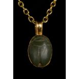 EGYPTIAN HARDSTONE SCARAB IN GOLD PENDANT