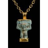 EGYPTIAN FAIENCE SHU AMULET IN LATER GOLD PENDANT