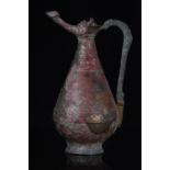 SELJUK BRONZE EWER WITH GEOMETRIC DESIGNS