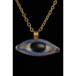 EGYPTIAN GLASS EYE INLAY IN LATER GOLD PENDANT